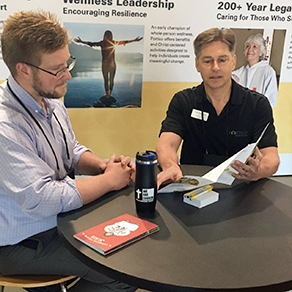 Kurt Kreienbrink, senior manager of Portico’s socially responsible investing, describing ELCA social purpose funds at Portico’s booth.